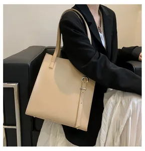Close-up of apricot leather tote bag with silver D-ring detail and premium matte finish