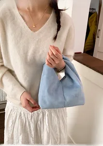 Close-up of light blue suede tote bag showing soft texture and minimal Korean style