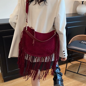 Retro burgundy suede tote bag with long tassels and wide shoulder strap for women