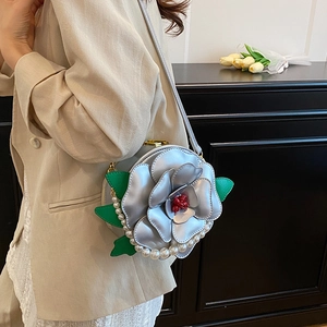 Minimalist silver floral round crossbody bag with pearl strap and leaf detail