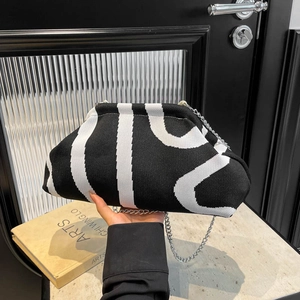 Fashionable black and white striped knitted shell bag with silver metal chain strap