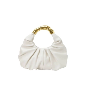 White ruched cloud handbag with elegant gold metal bamboo handle shown on plain background
