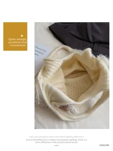 Detail of knit shoulder bag featuring open-top design and 3D floral accents