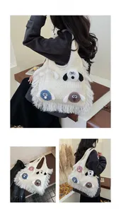 Detail of cream knit tote bag featuring fringe trim and cute plush puppy charms