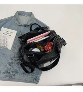 Interior view of large capacity black tote bag showing space for tablet and essentials