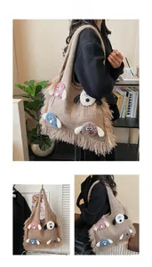 Detailed macro view of brown knit tote bag featuring cute cartoon dog patches and tassels