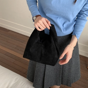 Minimalist black suede handbag with pleated design and elegant top handle for women