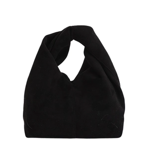 Minimalist black faux suede handbag with a knotted handle and sleek rounded design