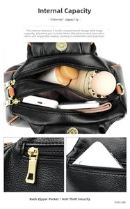 Detailed view of the black pebbled leather handbag interior and back zipper pocket
