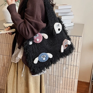 Cute black plush tote bag featuring colorful cartoon dog embroidery for a cozy look
