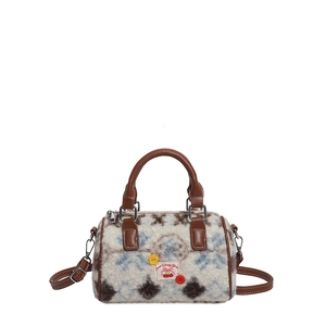 Retro plush Boston bag with brown cow print pattern and detachable shoulder strap