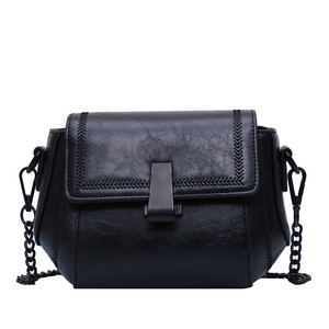 Classic black crossbody bag with chevron stitching and matte metal chain strap for women