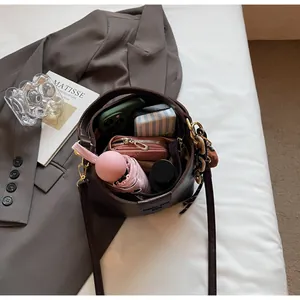 Top view of deep brown bucket bag interior showing large capacity for daily items