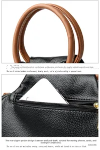 Detail of reinforced brown handles and anti-theft back pocket on black leather tote bag