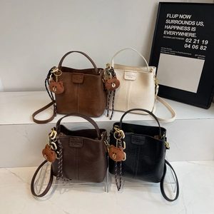Vintage PU leather bucket bag with top handle and teddy bear charm in four colors