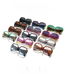 Flat lay of colorful oversized square sunglasses in black, leopard, and violet shades