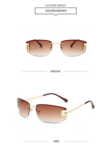 Detail view of gold metal hinges with G-shaped logo on rimless brown gradient sunglasses