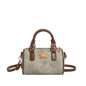 Modische graue Canvas-Boston-Tasche mit braunem Lederbesatz und Metallplatten-Detail
