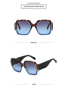 Detail view of large square leopard sunglasses with gradient blue lenses and geometric temples