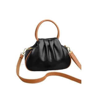 Fashionable black cloud-shaped pleated handbag with brown handles and shoulder strap