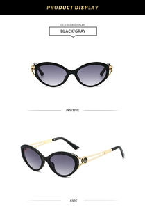 Detail of cat-eye sunglasses with black frames and gold metal temples in macro view