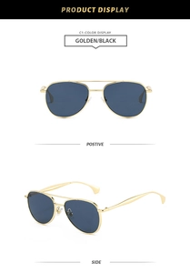 Détail de lunettes aviateur en métal doré avec double pont et verres foncés