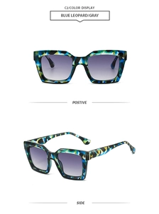 Detail view of blue leopard pattern frames and gray gradient lenses on square sunglasses