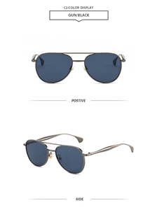 Détail de lunettes pilote avec monture à double pont gris fusil et verres teintés foncés