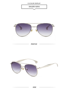 Détail de lunettes aviateur en métal argenté avec verres dégradés violets et double pont