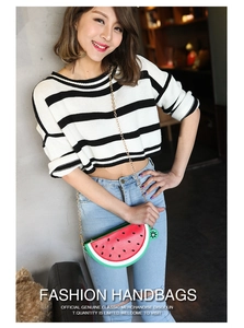 Creative watermelon-shaped crossbody bag with seeds and gold chain strap on model