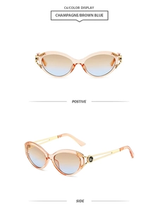 Detail view of champagne cat-eye sunglasses with gradient brown blue lenses and metal arms