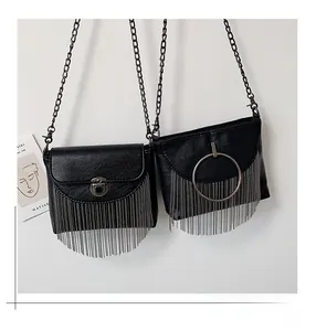 Detail view of black PU leather bags with silver chain tassels and metallic chain straps