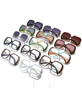Multiple stylish oversized square sunglasses in assorted colors with metal accents
