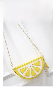 Close-up of lemon slice crossbody bag showing yellow leather texture and chain strap