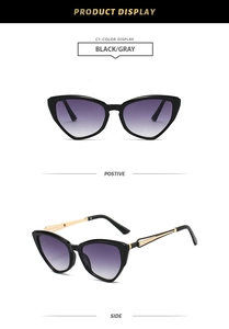 Detail view of cat eye sunglasses with purple gradient lenses and gold metal temples