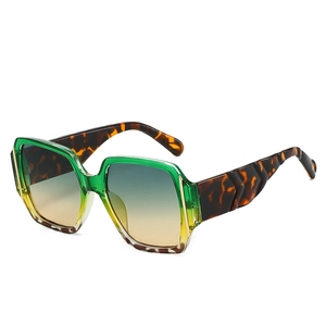 Modern oversized square sunglasses with green gradient frames and tortoiseshell temples