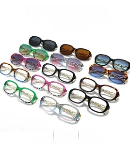 Flat lay of small rectangular sunglasses featuring unique golden chain temples in various colors