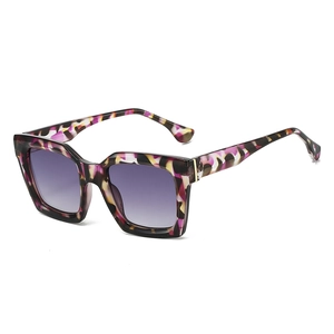 Fashionable oversized geometric sunglasses with purple gradient lenses and tortoiseshell frame