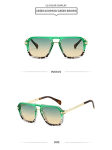 Detail view of square double-bridge sunglasses with green gradient lenses and metal temples