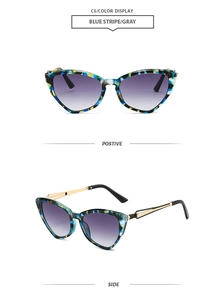 Detail of C5 cat eye sunglasses with blue stripe frame and purple gradient lenses