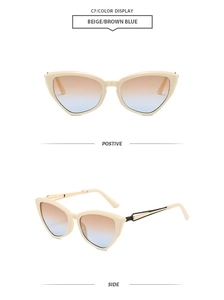 Detail view of beige cat eye sunglasses featuring gold hollowed metal temples and gradient lenses