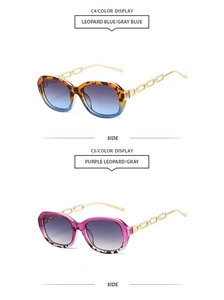 Detail of metallic chain temples on leopard print sunglasses with gradient lenses