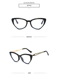 Detail view of stylish black cat eye frames with elegant gold metal temples and hinges