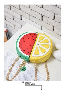 Detail of creative fruit shaped crossbody bag with watermelon and lemon patterns