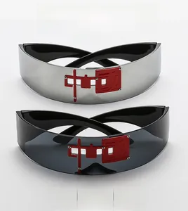 Detail of futuristic wraparound sunglasses with red Chinese character logo on the lenses