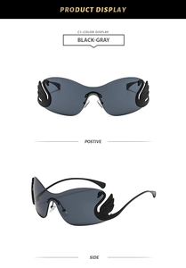 Detail view of rimless swan temple sunglasses with dark gray lenses and crystal accents