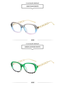 Detail of trendy small frame sunglasses featuring gold metal chain temples in side view