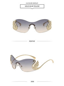 Detail of rimless sunglasses with gold swan decor and blue-yellow gradient lens