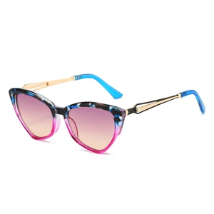 Fashionable colorful cat-eye sunglasses with gradient lenses and golden metal temples