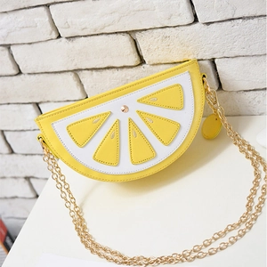 Lemon-shaped crossbody bag with yellow PU leather slices and a gold metal chain strap